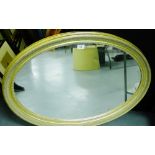 A contemporary gilt wood oval framed wall mirror, 85 x 60cm