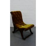 An X-framed chair with button back upholstery and gilded mounts, 80 x 50cm