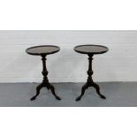 A pair of circular top side tables on tripod supports, 55 x 36cm (2)