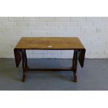 A drop flap coffee table on lyre supports, 120 x 45cm