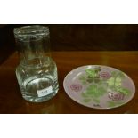 A contemporary clear glass decanter water set together with a pink floral decorated opaque glass