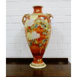 A Japanese earthenware twin handled baluster vase of large proportions, the terracotta ground