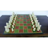 The British Museum replica chess men depicting The Isle of Lewis Chess Set, together with a