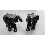 A pair of early 20th century large ebonised elephant figures, 37 x 43cm (2)