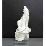 A Nao Spanish porcelain model of a Polar Bear, modelled seated upon a rocky plinth base, 24cm high