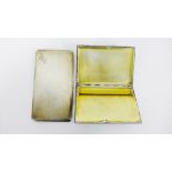 Two Birmingham silver cigarette cases, each with engine turned decoration (2)