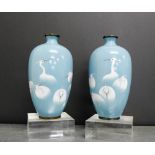A pair of Japanese enamelled baluster vases, the pale blue ground with cranes, 19cm high (2)