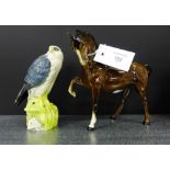 A Beswick horse, together with a Royal Doulton Whyte and MacKay Scotch Whisky merlin decanter (2)