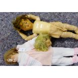 A collection of vintage dolls to include a German bisque head doll with brown sleeping eyes and