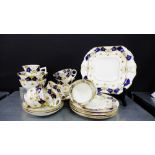 A Beswick & Sons porcelain teaset with gilt rims and cobalt blue borders with small floral sprays