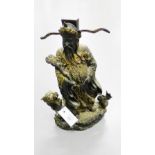 A gilded bronze cast figure of Sage, modelled standing upon a Dragon mounted swirling base, 40cm