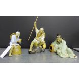 A collection of three Chinese Shiwan glazed stoneware figures, comprising two fisherman and