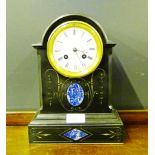 A Victorian black slate and blue hard stone inset mantle clock, the domed top above a white enamel