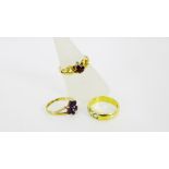 A collection of three gold gemset dress rings to include an 18ct gold ring set with three pale