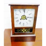 A Jerome & Co, Newhaven USA clock with painted dial and Roman numerals, housed in a stained pine