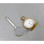 A gold plated pocket watch together with a pair of white metal folding spectacles