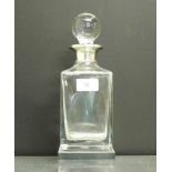 A silver collared square cut spirit decanter and stopper, 25cm overall