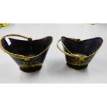 Two black and gilt helmet shaped pails (2)