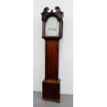 An 18th century oak cased Grandfather clock with a broken swan neck pediment over a painted dial,