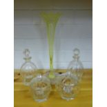 A yellow opaque flower vase on moulded leaf base, together with a pair of miniature lobbed decanters