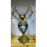 An Italian porcelain and brass mounted vase, the baluster body painted with figures to a cobalt blue
