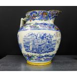 A 19th century blue and white Masonic jug in the font pattern depicting Masonic emblems, crests