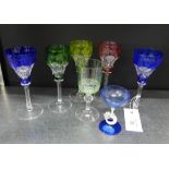 A set of five Harlequin coloured hock drinking glasses, together with a uranium green glass and