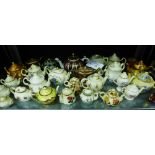 A collection of miniature porcelain tea pots to include Masons Brown Velvet pattern, Crown