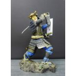 A Samurai figure, the base inscribed K. Fallon, 1992, 24cm high