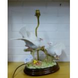 A Capodimonte Doves table lamp on polished wood base, size excluding light fitting 38cm high