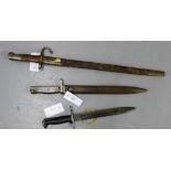 A WWII US UFH short bayonet together with a Turkish bayonet and scabbard and a German WWII bayonet