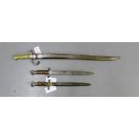A British WWI bayonet and scabbard together with two short bayonets (3)