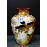 A Japanese Kutani baluster vase, well painted with Chrysanthemums, Wisteria and birds, signed to the