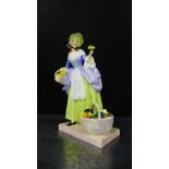 A Royal Doulton china figure 'Spring Flowers' HN1807, with registration no. 820494, having printed