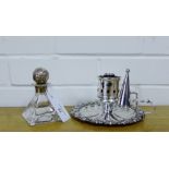 An Epns candle snuffer, together with a clear glass scent bottle of pyramid form with a silver