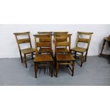 A set of six Edwardian oak bible chairs with spar back and solid seats on turned supports and