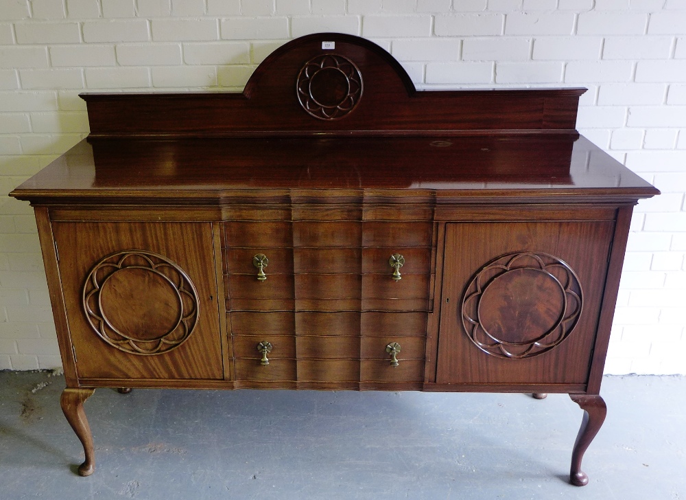 A mahogany ledgeback sideboard, the rectangular top over an arrangement of two serpentine fronted