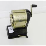 A vintage Boston Vacuum Mount pencil sharpener,