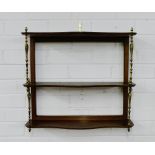 A mahogany wall shelf on turned brass supports, 48 x 54cm