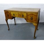 A walnut veneered side table, the rectangular moulded top over a single long drawer flanked by a