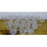 A quantity of drinking glasses with geometric hobnail cut decoration (24)