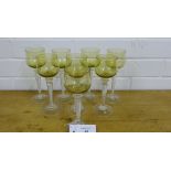 A set of eight green glass bowls on facet stems with spiral twist inclusions (8)