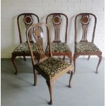 A set of four mahogany dining chairs with splat back and flowerhead motif, with floral upholstered