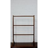 A mahogany towel rail