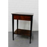 A rosewood side table, the rectangular top over a single drawer on tapering supports with undertier,