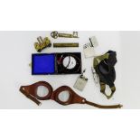 A mixed lot to include a Wireless Test Meter - The Wates, two pairs of flying goggles, brass key