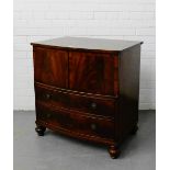 A mahogany bow front commode, the lift up top over two dummy drawers raised on bun feet, 76 x 74cm