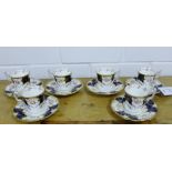 A set of six Coalport porcelain cabinet cups and saucers, the white ground with gilt edges and