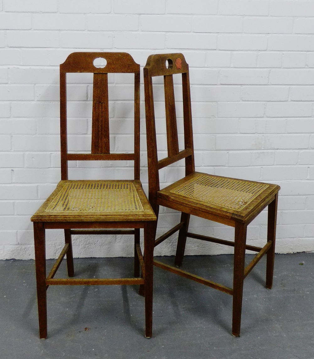 A pair of oak Arts & Crafts side chairs with cane seats (2)