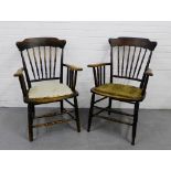 A pair of oak spindle back open armchairs (2)